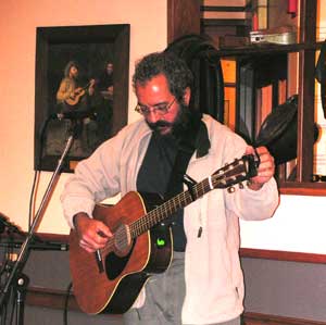 Photo: Nick tuning up at Vic's Music Corner